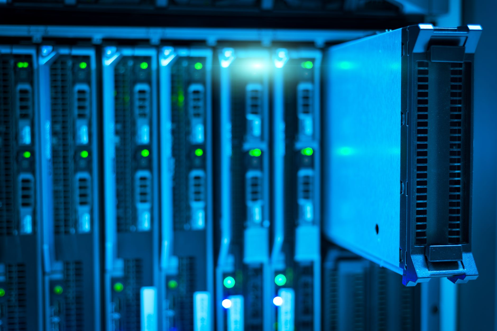 Rows of advanced server racks glowing in a modern high-tech data centre facility.